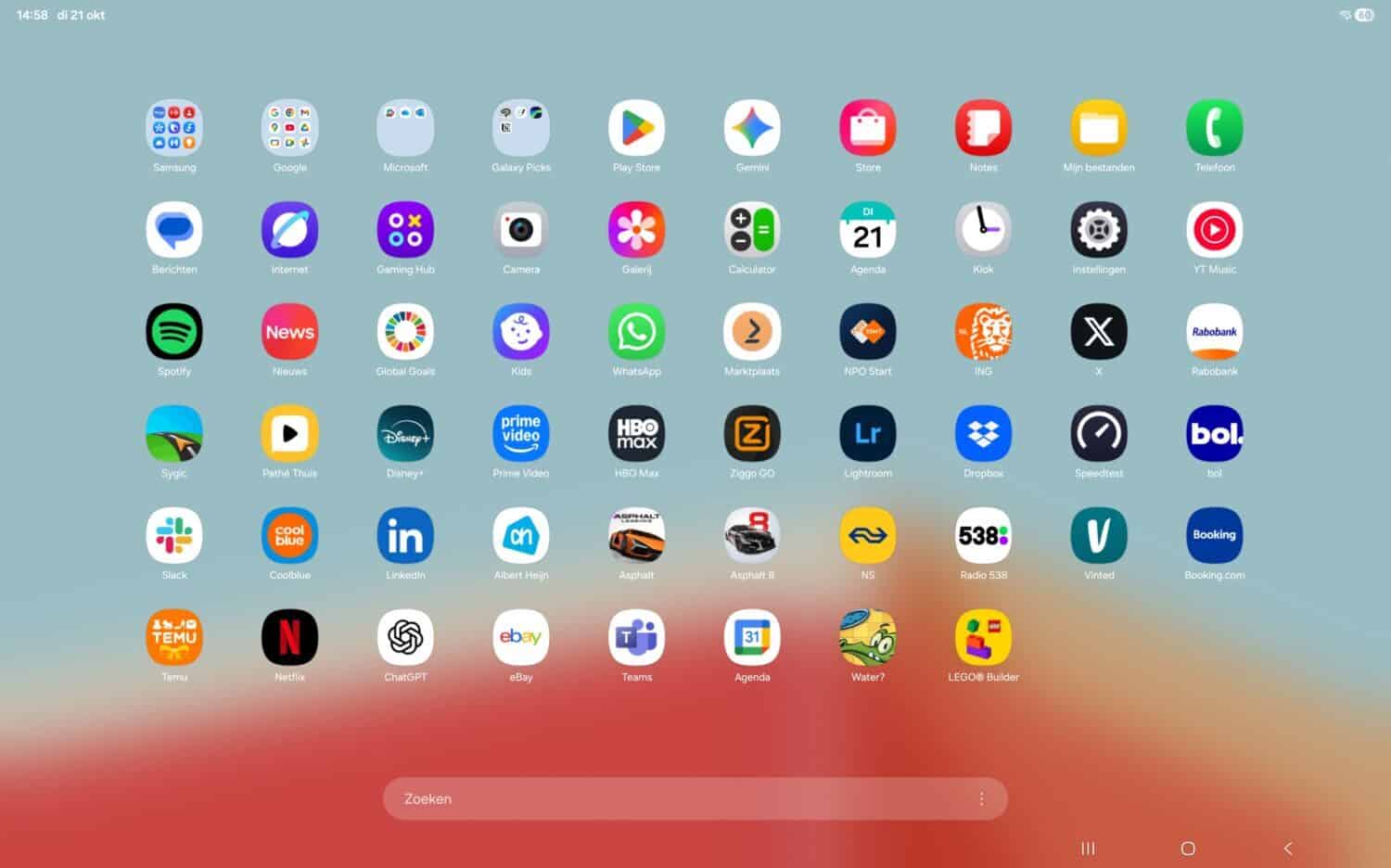 Het startscherm van een Samsung Galaxy Tab S11 Ultra toont vijf rijen met verschillende app-iconen, waaronder Google, Netflix, WhatsApp, Prime Video, Booking.com, Bol.com en anderen, tegen een onscherpe achtergrond.